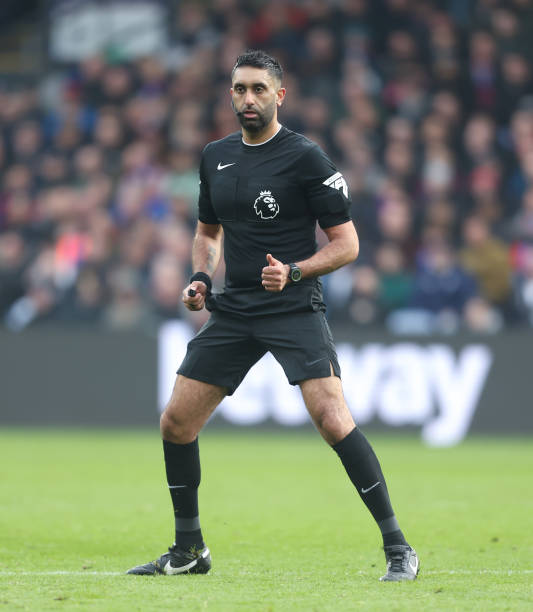 Sunny Singh Gill officiating a football match